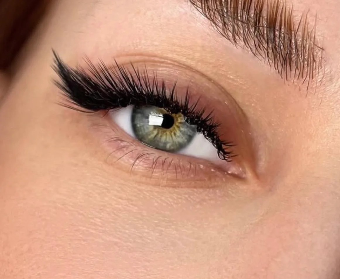 Extreme close-up of a full volume lash extension set, editorial beauty photography